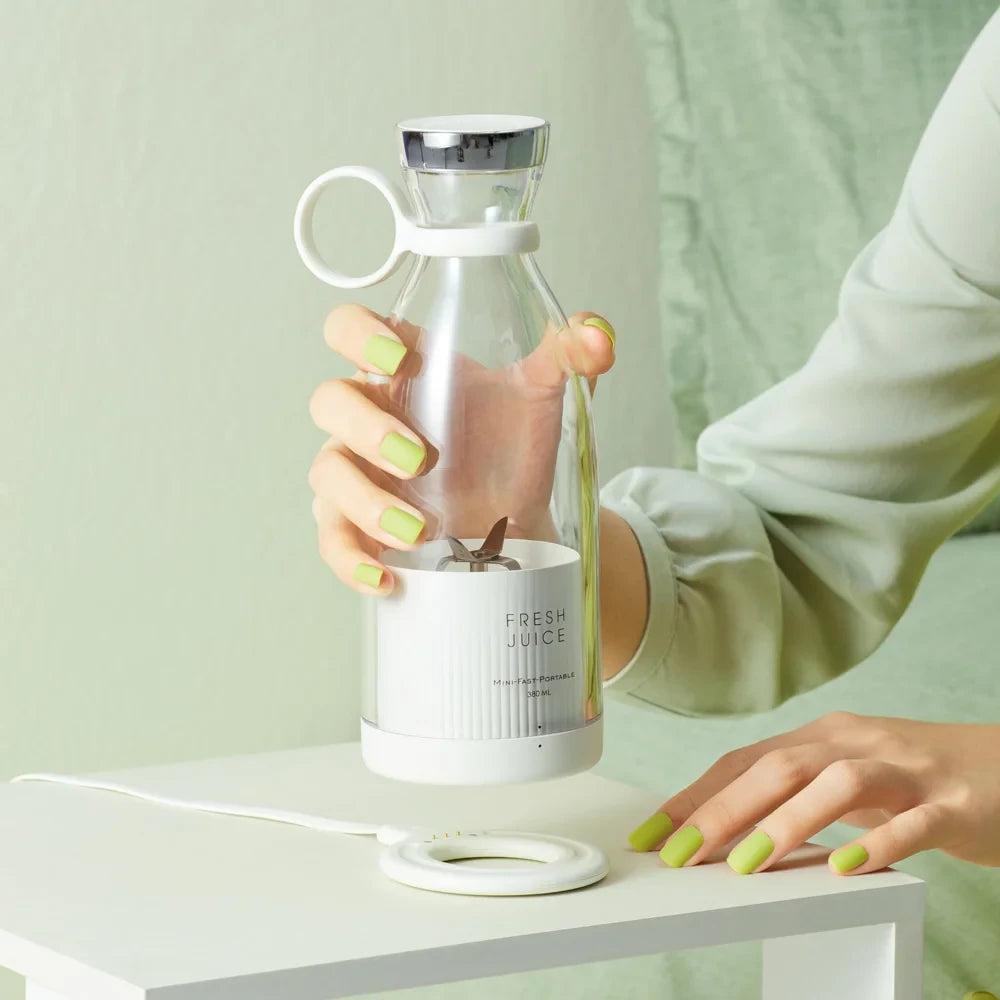 White portable Fresh Juice electric blender with stainless steel blade – front view on white background