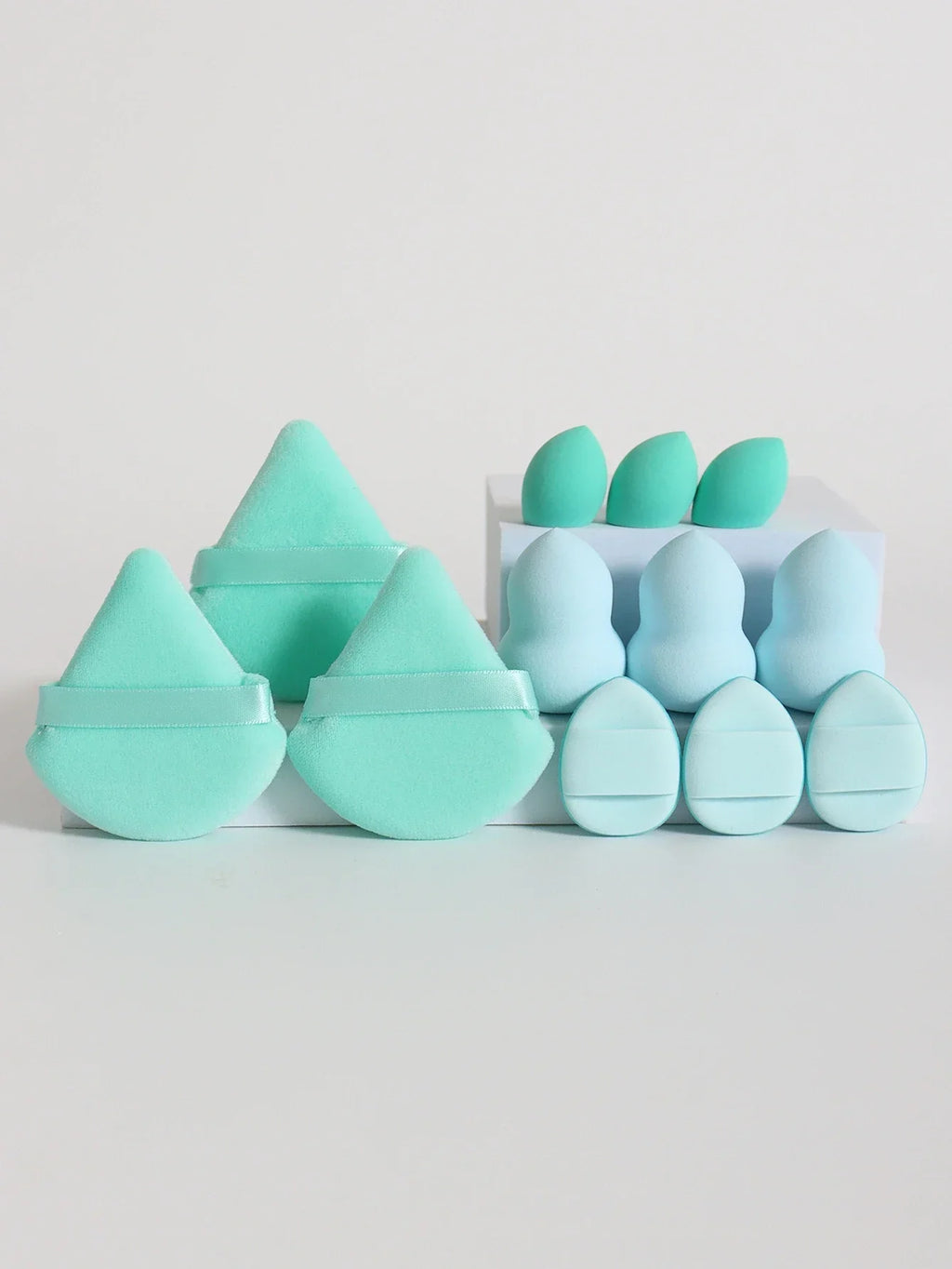 12-piece makeup sponge set with powder puffs blending sponges and beauty eggs in turquoise