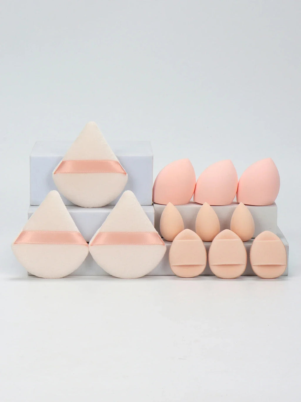 12-piece makeup sponge set with powder puffs blending sponges and beauty eggs in pink and beige