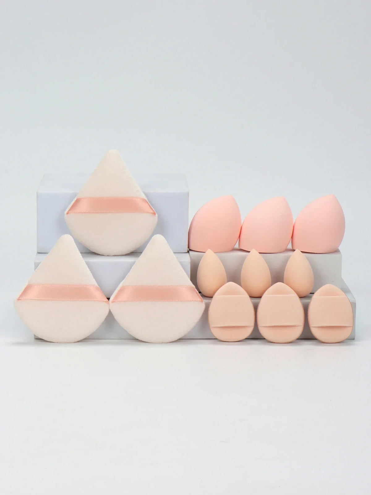 12-piece makeup sponge set with powder puffs blending sponges and beauty eggs in pink and beige