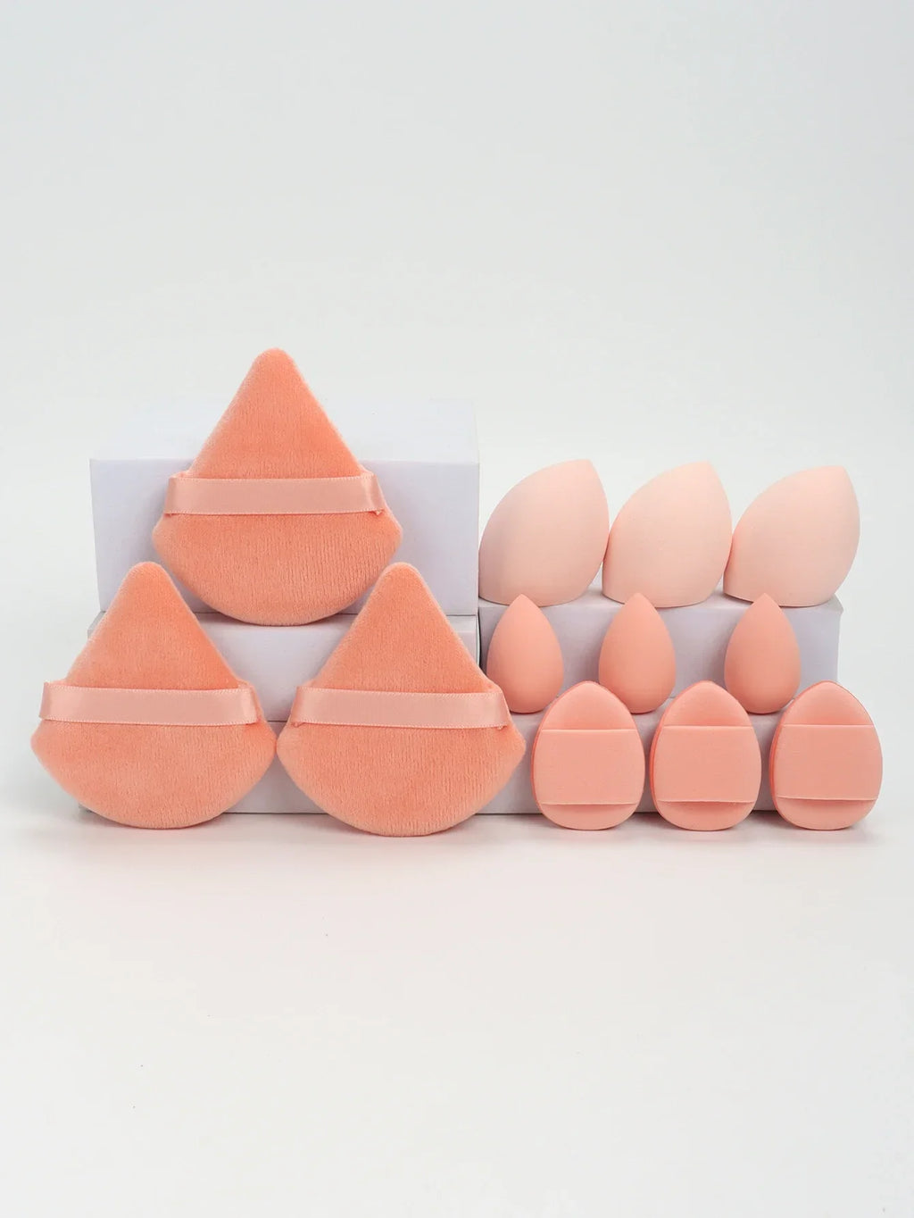 12-piece makeup sponge set with powder puffs blending sponges and beauty eggs in orange