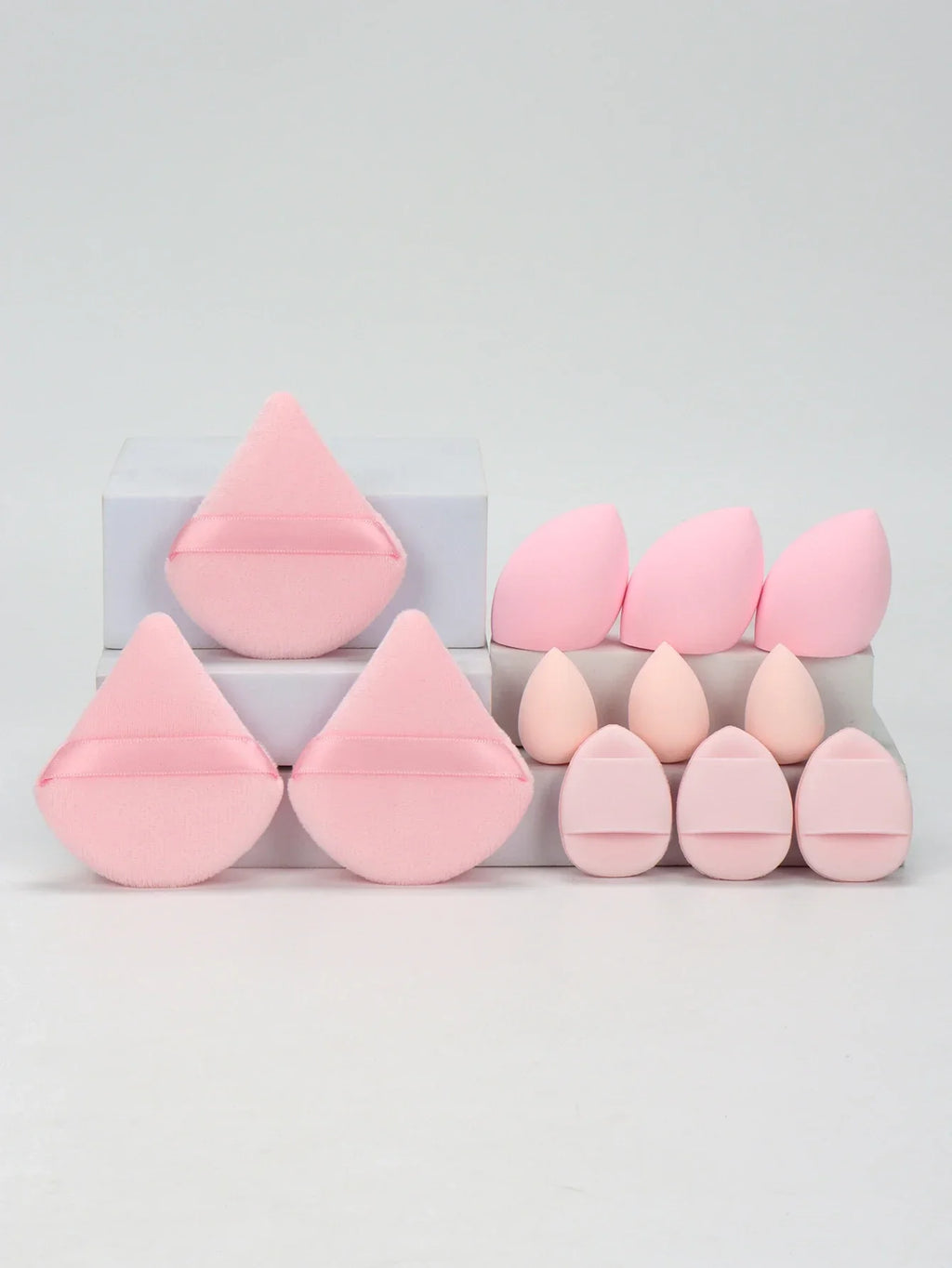 12-piece makeup sponge set with powder puffs blending sponges and beauty eggs in light pink