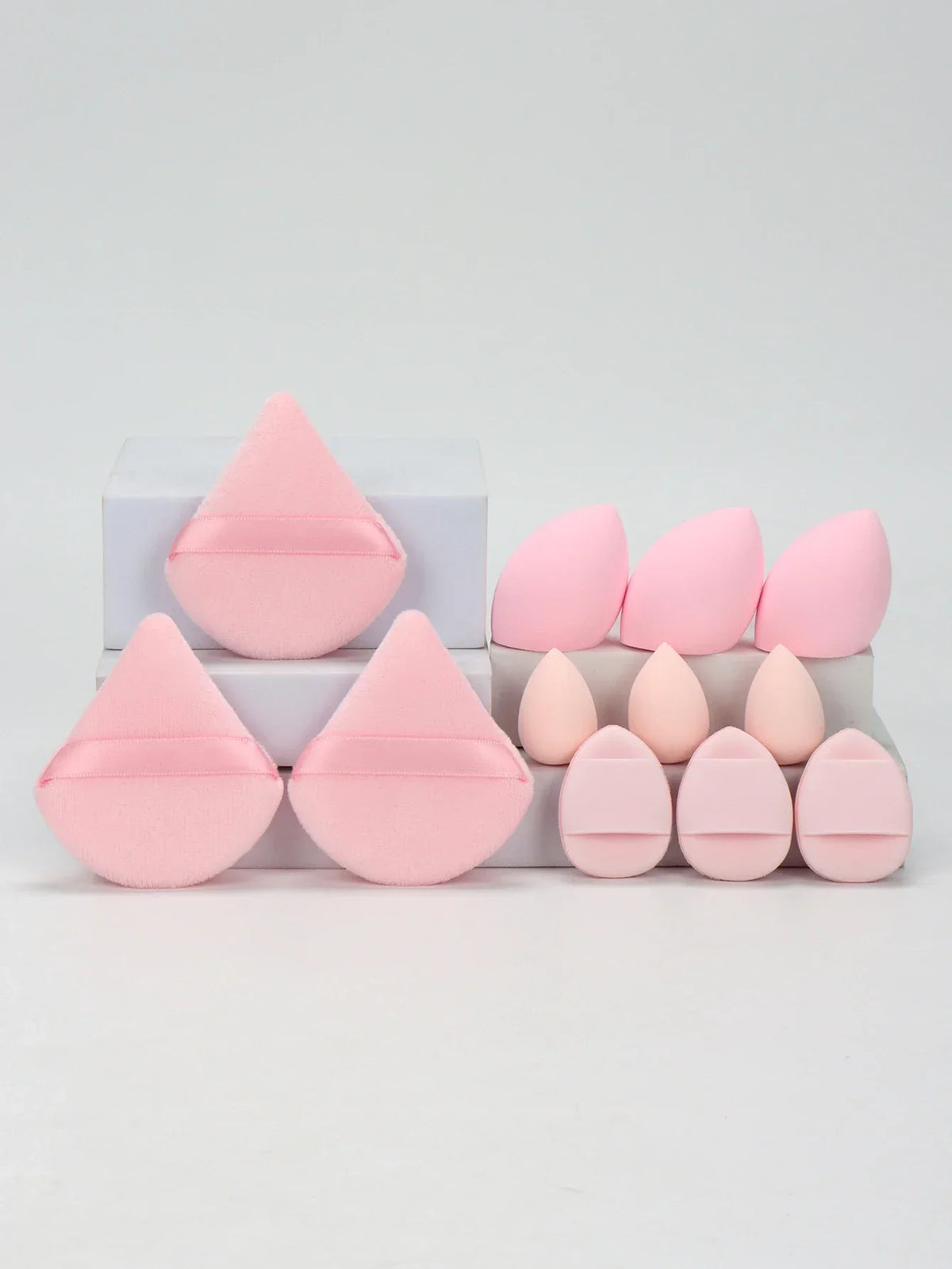 12-piece makeup sponge set with powder puffs blending sponges and beauty eggs in light pink