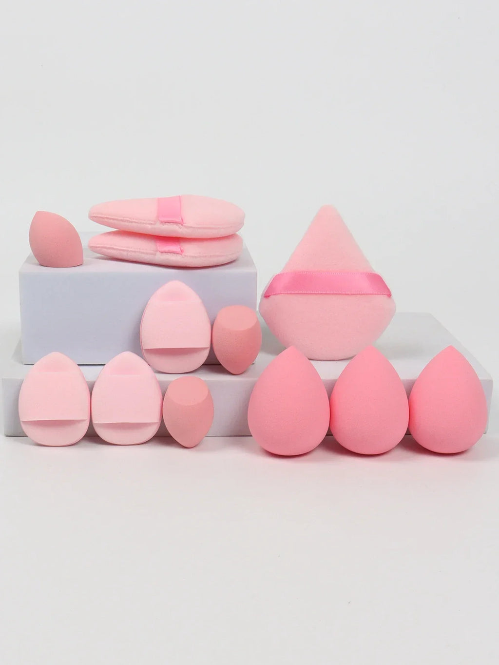 12-piece makeup sponge set with powder puffs blending sponges and beauty eggs in pink