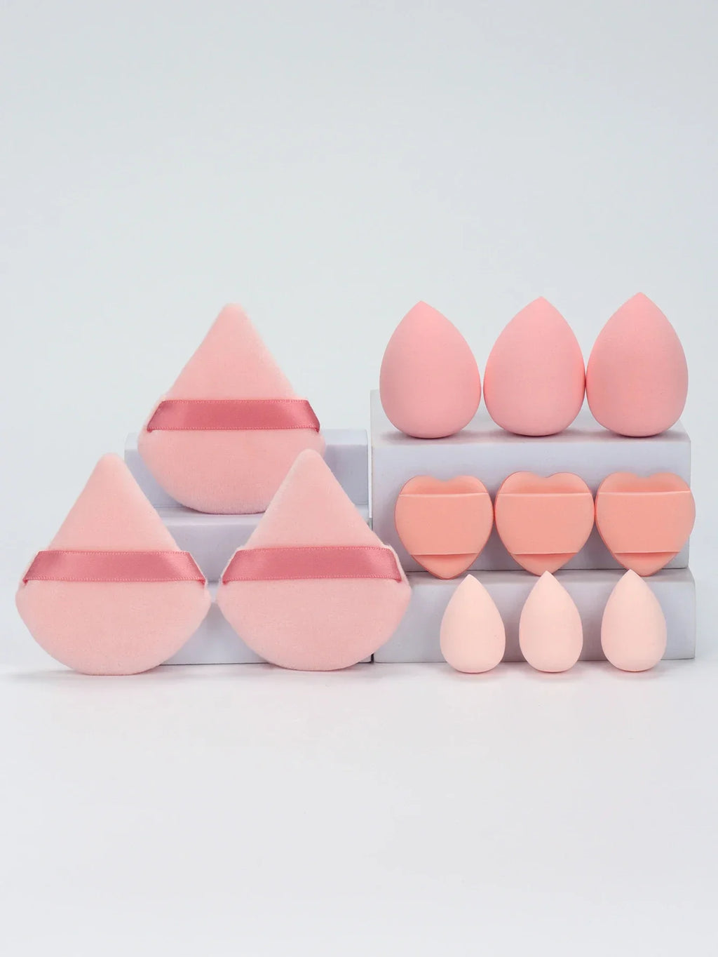 12-piece makeup sponge set with powder puffs blending sponges and beauty eggs in pink and beige